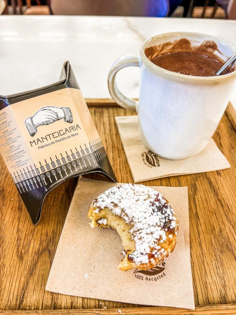 Pastel da nata and hot sipping chocolate from Manteigaria in Porto, Portugal