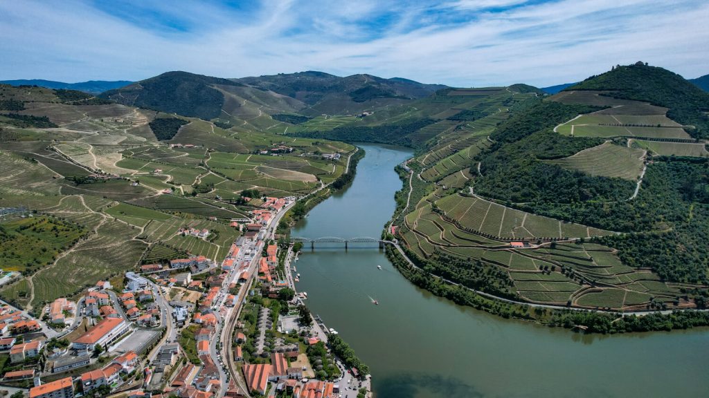 Aerial drone view of Pinhão, Portugal and the terraced vineyards of the Douro River Valley