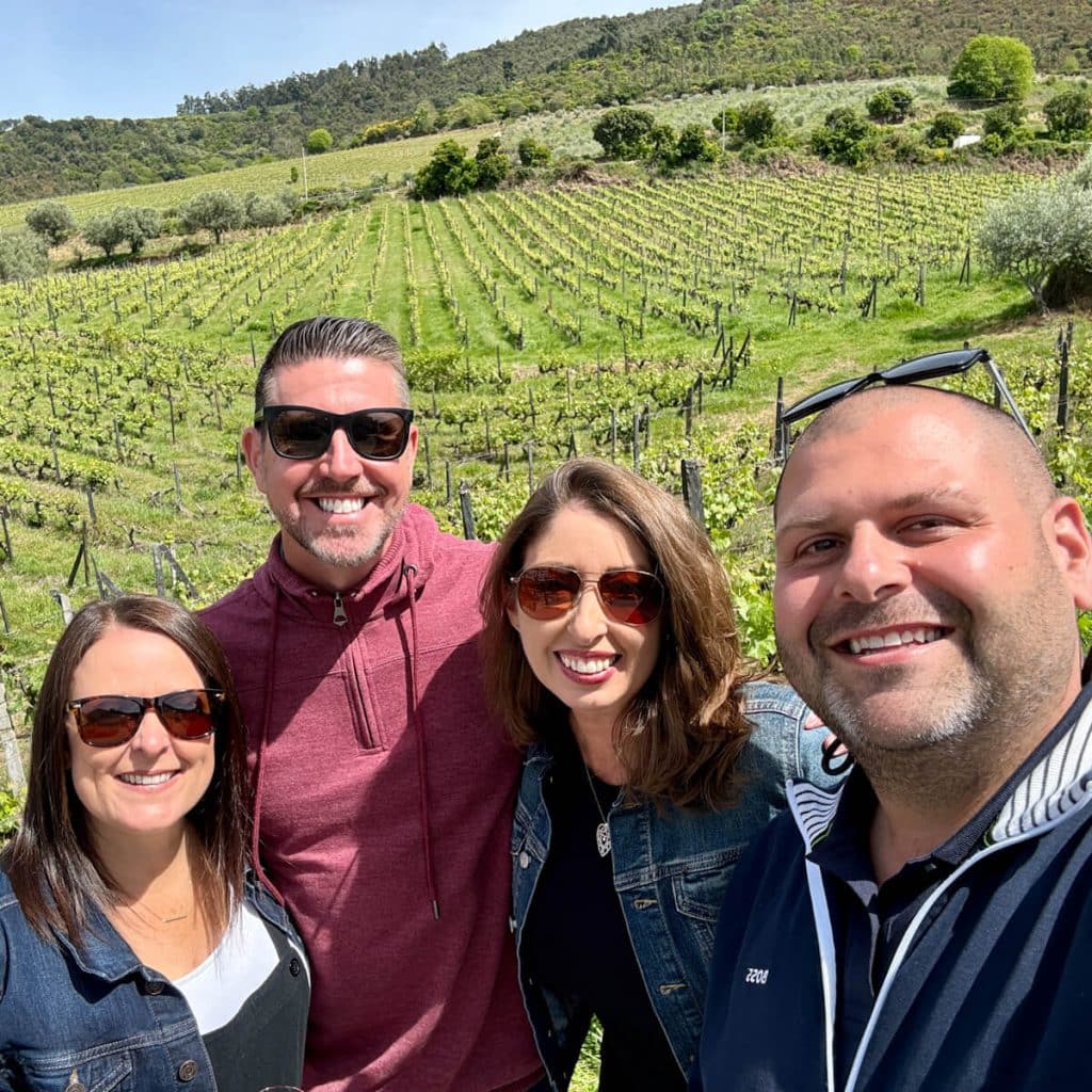 Four friends visiting a winery in Douro Valley Portugal